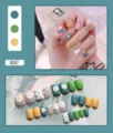 Detailed macro view showing a full set of 24 cute daisy and polka dot press-on nails - Poached Egg Pattern Style (R007) / 24Pcs Set (Glue Style) / Green/Yellow/Grey Patchwork
