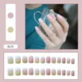 Detail view of pink and yellow floral matte press-on nails with full set layout - R173 Spring Leaves / Glue Type