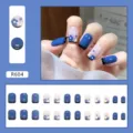 Close-up detail of cute blue and white floral press-on nails with 24-piece full layout - R604 Blue Flower (R604)