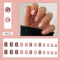 Pink short press-on nails set featuring smiley faces, black swirls and white floral motifs - Wave Smile Square Round Style (W682) / 24 Pcs/Set / Pink