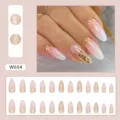 Detailed view of almond press-on nails with pink gradient and gold glitter accents - Pure Lust Glitter Almond Style (W684) / 24 Pcs/Set / Pink