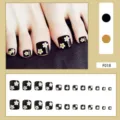 Schwarze künstliche Zehennägel mit Gänseblümchen-Design, 24er-Set für Pediküre. - 24er Set (Inklusive Kleber) / Schwarz Gänseblümchen Druck (F018)