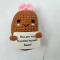 Handmade crochet cute bean doll detail view showing exquisite knitting and funny sign design. - Butterfly Coffee Bean