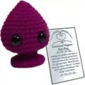 Close-up detail of purple crocheted emotional support plush with a humorous gift card - Rose Red Plug With Large Card