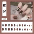 Close-up detail of brown and cow print short square press-on nails set with 24 pieces - Coffee Milk Style (R627)