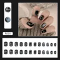 Detailed view of 24pcs black press-on nails with silver 3D heart and abstract art designs - Sweet Cool Heart Style (R630)