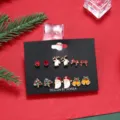 Detailed view of 6-pair Christmas stud earring set on a black display card. - 6 Pairs / Christmas Earrings Set TZ0450