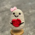 Handmade crochet cute plush doll with pink bow holding red heart ornament gift variant - Heart Potato Woman without Base
