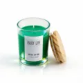 Green scented soy wax candle in glass jar with wooden lid for home fragrance decor. - Cedar
