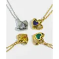 Detailed view of heart-shaped zircon necklaces in gold and silver plating options - Silver White Zirconia