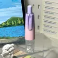 Close-up detail of gradient push correction tape in purple and pink, portable pen style. - Gradient Purple