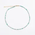 Detail view of a handmade beaded necklace featuring teal and white colors with gold accents. - Length 40cm + Extension 8cm / White Green Necklace