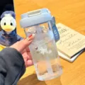 Cute portable plastic water bottle with straw, double drinking design for summer. - Samoyed Puppy Series
