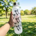 Detailed view of a frosted portable water bottle featuring stylish black bow prints - 1000ml / Black Bow (Silver Cap)