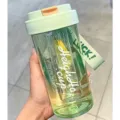 Close-up view of a portable green leakproof plastic water bottle with tea separation. - Third Gen Tea Filter Cup / 600ml / Green