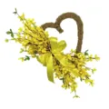 Detail view of heart-shaped wreath with yellow forsythia flowers and a large satin bow. - Yellow