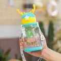 Gourde en plastique pour enfants avec motif dinosaure et sangle de transport réglable - Vert 600ml