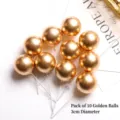 Close-up of ten 3cm golden decorative cake topper spheres with insert sticks - 金球3cm(10个装)