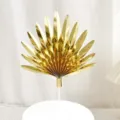 Gold fan-shaped leaf cake topper detail close-up, shiny paper baking decoration for party. - 16cm / Gold Glossy