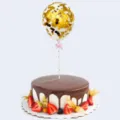 Macro view of a 5-inch confetti cake topper balloon filled with shimmering gold sequins - Gold