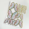 Schmetterling Tortendeko mit Goldfolie und Aquarell-Design in Rosa und Blau auf Karte - Set / bunt