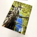 Detailed view of the A4 lecture notebook featuring a scenic tree photo cover design. - Summer Notebook