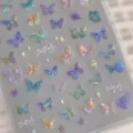 Detail shot of shimmering iridescent holographic butterfly nail stickers on a clear sheet - Butterfly Wing Iridescent Sticker