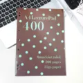 Detailed view of brown A4 refillable notebook with cyan polka dots and lined paper specs. - Brown Polka Dot Slim Notebooks