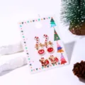Detail van kerstoorbellen set met rendier en kerstman ontwerpen in gekleurd emaille. - Kerstrendierhoofd Stijl (2#)