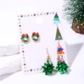 Detail of Christmas earring set featuring green wreath studs and metallic bow drops - Green Wreath Style (16#)