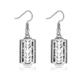 Close-up of vintage silver razor blade drop earrings featuring unique blade design. - Razor