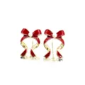 Detailed view of red enamel bow earrings with a central pearl for Christmas outfits. - Ribbon Bowknot