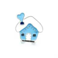 Macro view of blue and white enamel house brooch with sparkling heart chimney detail - Blue House