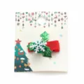 Christmas hair clip for kids featuring red ribbon and green holly with snowflake - Holly Leaf and Snowflake Style