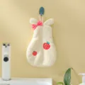 Hanging coral fleece hand towel detail showing rabbit ears and sweet strawberry design. - 28*17cm / Off White