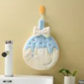 Soft blue donut-shaped hand towel with a cream bow and hanging loop - 20x28cm / Sky Blue