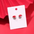 Festliche Weihnachts-Ohrstecker mit lächelndem Gesicht und roter Weihnachtsmütze - Emoji Christmas Earrings