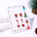 Kerst oorbellen set met bel, zuurstok en ster op een feestelijke presentatiekaart - Pentagramstijl (3#)