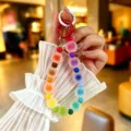 Detailed view of a colorful frosted jelly bead phone charm featuring a vibrant rainbow gradient - Creative Colorful Jelly Beads (yc5360) / Multicolor (Random)