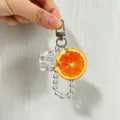 Detailed view of creative fruit keychain with realistic orange slice and ice cube - Orange (yc-5343-Orange)