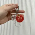 Detailed view of a creative tomato fruit keychain with ice cube charm and clear beads - Tomato (yc-5343-Tomato)