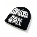 Detailed shot of the white 'SENIOR SIN' jacquard pattern on a black knitted beanie. - Letter Jacquard Style / Black