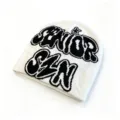 Detailed close-up of a white knit beanie featuring black jacquard SENIOR SZN lettering - Letter Jacquard Style / White