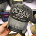 Detailansicht einer grauen Vintage-Baseballkappe mit markanter OCEAN-Stickerei - 55-60cm / Hellgrauer Schirm (OCEAN)
