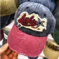 Detailaufnahme einer Vintage-Baseballkappe mit Athlete-Stickerei und Sternenlogo - 55-60cm / Marineblau (Athlete)