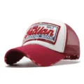 Detailed view of a maroon and white embroidered trucker hat with vintage distressed brim - Adjustable / Burgundy