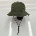 Detailed view of olive green waterproof bucket hat with adjustable black chin strap cord. - M (56-58cm) / Bucket Hat / Army Green