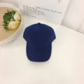 Detailed view of solid navy blue suede baseball cap showing fine fabric texture - One Size / Navy Blue