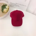 Detailed view showing the premium suede texture of this wine red solid color baseball cap - One Size / Burgundy