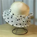 Elegant women's sun hat featuring polka dot organza brim and a large decorative flower - 56-58cm / Beige